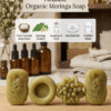 Four pieces of organic moringa soap in oval, round, and floral shapes with ingredient icons.