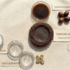 Organic coffee soap with liquid extracts, distilled water, and coffee beans for skin brightening.
