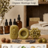Three shapes of organic moringa soap displayed on wood with Niacinamide and Gram Flour icons below.