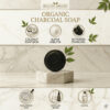 Oval organic charcoal soap with leaf imprint for acne care and skin detox.